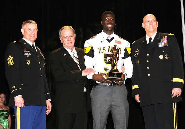 Army Leadership and Trophy Namesake Pose with Army Player of the Year Award Winner
