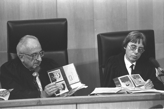 SUPREME COURT JUSTICE DOV LEVIN  DISTRICT AND COURT JUDGE DALIA DORNER LOOKING AT A PHOTO ALBUM DURING THE TRIAL OF JOHN (IVAN) DEMJANJUK