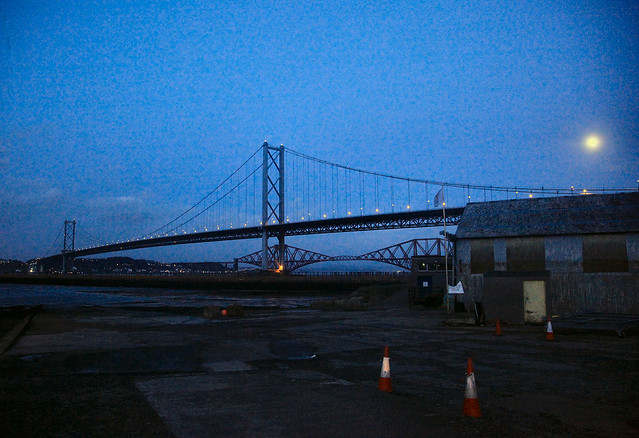 The closed Forth Road Bridge, about to be reopened after dusk on the day of a notable storm.