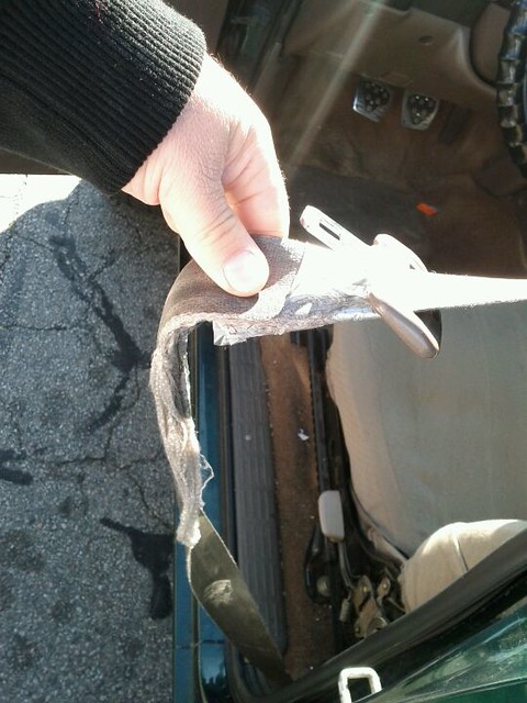 Finally getting around to fixing the seatbelt.  It was a little damaged.