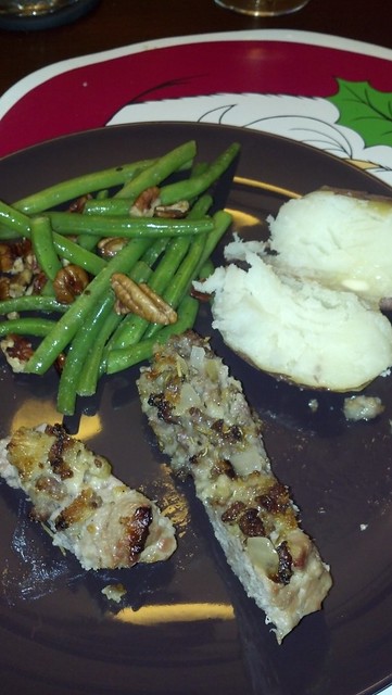 Pork loin with apple and sausage stuffing, salt ROASTED POTATOES, and pecan snap beans.