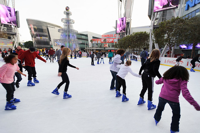 Visiting Badger fans join local Los Angeles residents skating at an outdoor ice rink at L.A. Live adjacent to the JW Marriott Hotel in downtown Los Angeles. (Photo by Jeff Miller)