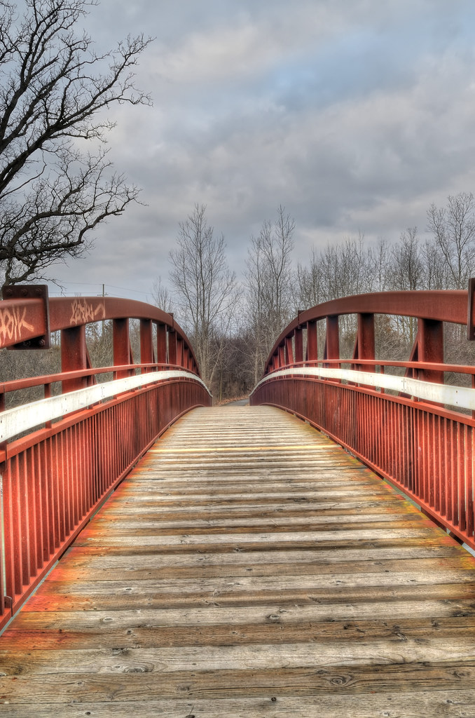 Red arch bridge over the Huron River