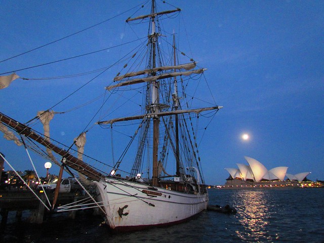 Sydney Opera House with moon and boat