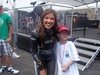 Miss Sprint Cup Monica strikes a pose with NASCAR Dreams child