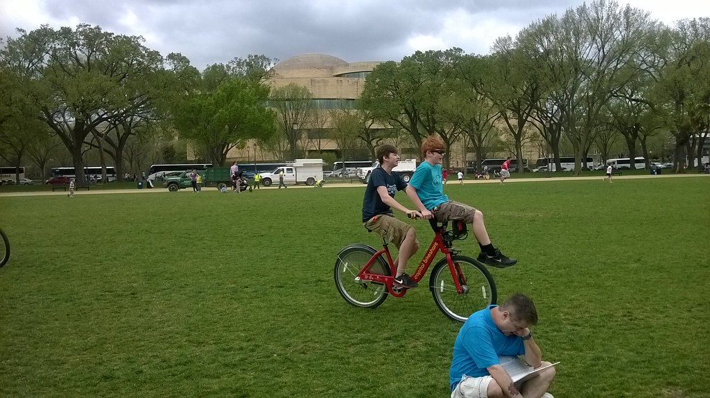 : Capital Bikeshare bike being shared on the National Mall.