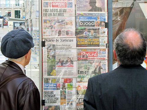 Reading the newspapers, Lisbon, Portugal