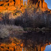As sun sets, Cathedral Rock lights up its reflection in Oak Creek