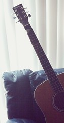 Acoustic Guitar On Couch
