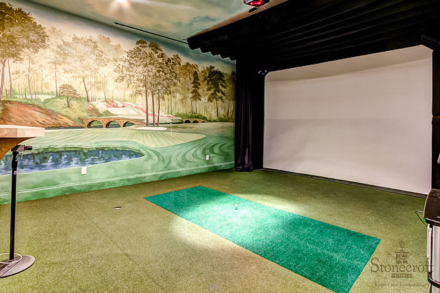 In honor of the MASTERS GOLF TOURNAMENT this week check out this golf simulator room complete with hand painted murals of Augusta National.