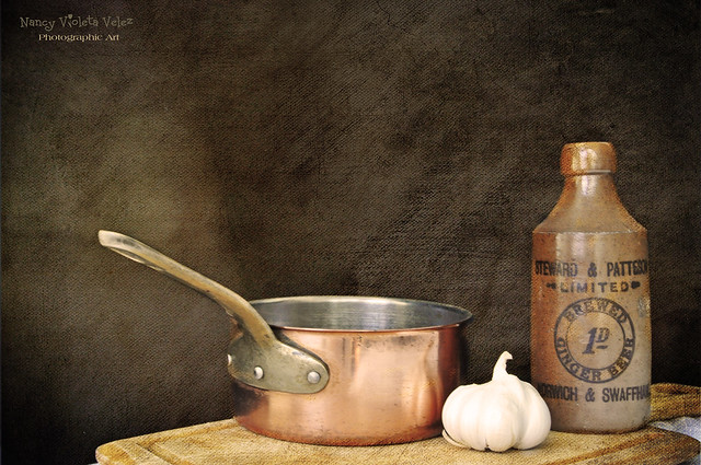 Copper pan, garlic, vintage bottle and my every day cutting board