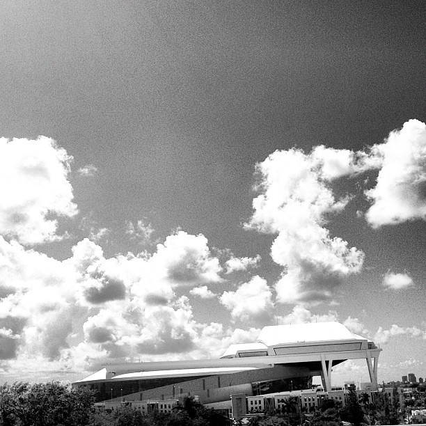 New #marlins #stadium ready for liftoff.... #modern #architecture #structure #design #lines #spaceship #sky #clouds #blackandwhite #monochrome