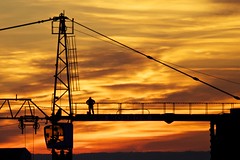 Crane Operator at Sunset