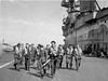 Operation PICKET I: RAF pilots walk towards their aircraft on the flight deck of HMS EAGLE after receiving their final instructions, before flying a reinforcement of nine Supermarine Spitfires to Ta Kali, Malta.