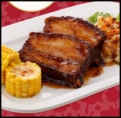 BBQ Baby Back Ribs served with warm BAcon Potato Salad and Corn on the cob