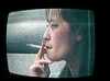 Asian woman smoking on TV, 1996