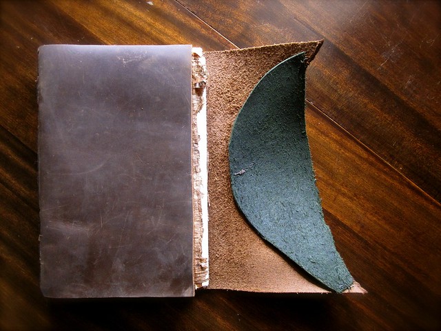 Classic leather journal handbound with artisan paper and papyrus
