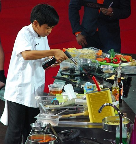 Philip prepares his dream dish, seafood Asian noodles, at the Junior MasterChef Pinoy Edition The Live Cook-off