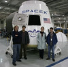Image: Tom X. Chao, Chris Paine & Friends with Dragon Capsule Model Inside SpaceXs Rocket Factory