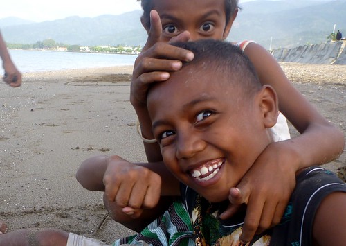 Boys play on Dili beach