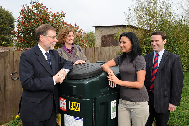Geting at closer look at the first ever oil pay as you go technology.  Pictured at one home where the technology is being piloted are Social Development Minister Nelson McCausland, resident Tracey Doherty from Dungannon, (back row) Jillian Ferris, Carilli