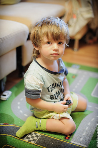 Boy is sitting on the floor. ©  Evgeniy Isaev
