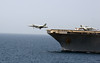 A jet launches from the USS Abraham Lincoln.
