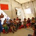 Syrian refugee children attend a lesson in a UNICEF temporary classroom in northern Lebanon, July 2014