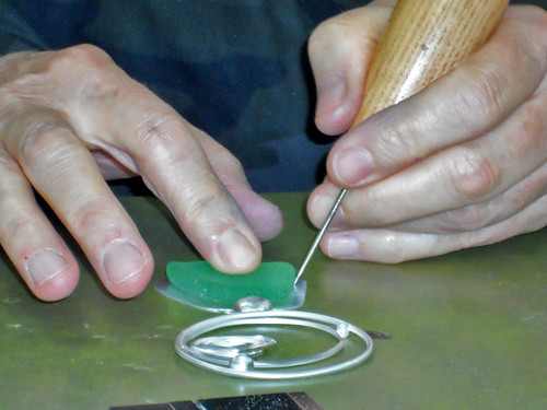 Claudia Goethe works on green seaglass for her jewelry at Joliet Junior College.