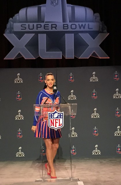 Singer Katy Perry at a Super Bowl XLIX press conference in Phoenix. She discussed her flaming hot costume, collaboration with Lenny Kravitz and mimicked Seattle Seahawks running back Marshawn Lynch when she said, Im just here so I dont get fined.