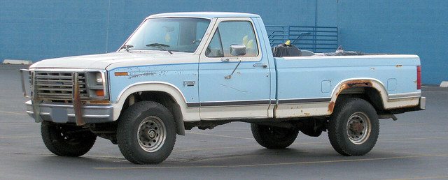 old blue white ford truck vintage rust 4x4 rusty pickup pickuptruck dent faded rusted oxidation vehicle weathered scratched load 1980s dents jalopy loaded beatup junker beater madeinusa americanmade fourwheeldrive dented oxidized fomoco twotone f250 worktruck farmtruck 34ton eyellgeteven