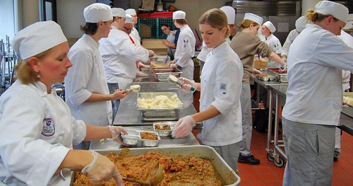 JJC student chefs create pre-packaged meals for Daybreak Shelter and Morning Star Mission of Joliet.