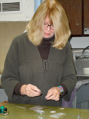 Susie Basak creates a piece of jewelry at Joliet Junior College.