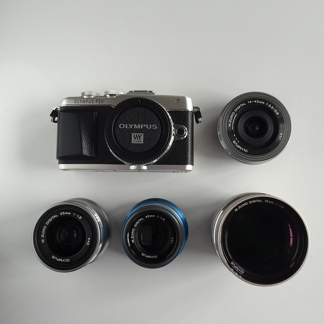 Olympus Pen EPL-7. Three primes and pancake lens to complete the kit.