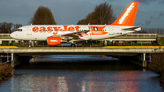 Easyjet on the bridge towards 36L at Schiphol • <a style="font-size:0.8em;" href="http://www.flickr.com/photos/125767964@N08/16357908156/" target="_blank">View on Flickr</a>