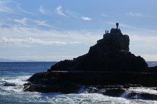 Rocky outcrop with olympic torch monument on top
