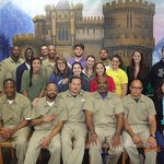 Students and inmates from a local prison pose for a photo