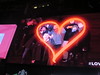 Ryan Janek Wolowski in a glowing red heart on the Revlon “LOVE IS ON” digital billboard in Times Square New York City for New Years Eve