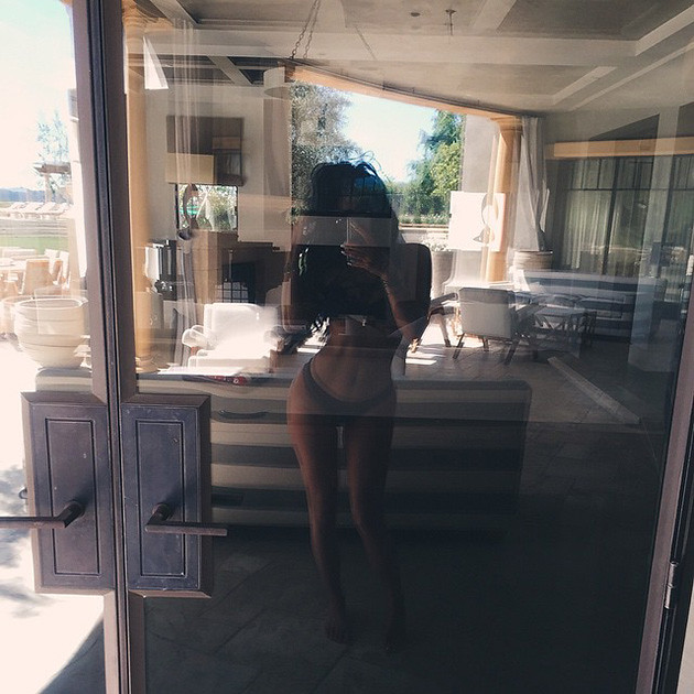 KYLIE JENNER relaxed by the pool looking hot as always!