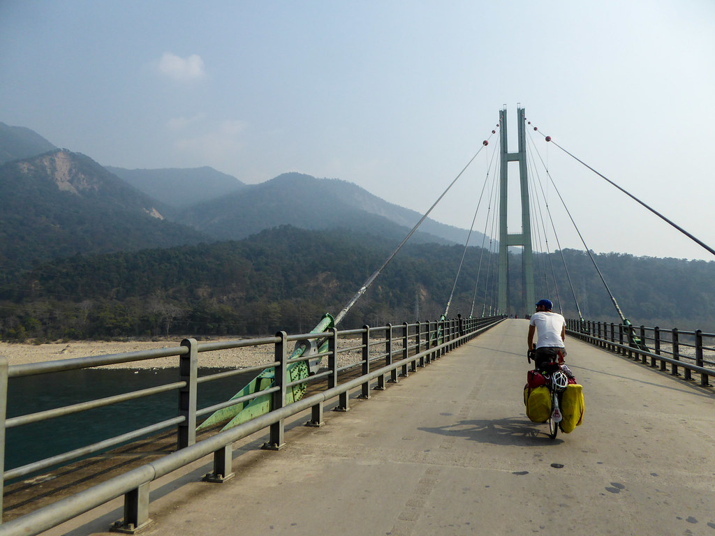 Crossing a suspension bridge in Nepal