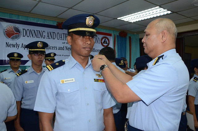 PCG Commandant Vice Admiral Rodolfo D Isorena led the donning and oath taking ceremony of the newly appointed and promoted officers of the Philippine Coast Guard.  The officers composed of the five newly commissioned probationary ensigns who were graduate