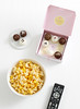 cake truffles from Sharis Berries buttered popcorn in bowl and television remote control