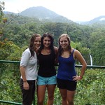 Students pose in a rainforest while studying abroad.