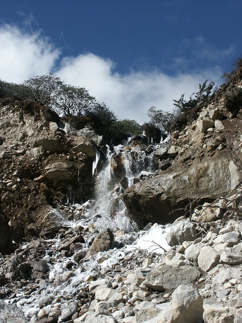A waterfall descending into the Hinku Khola