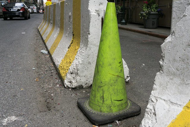 Green! cone Project Green Street Photography NYC Photography Traffic Cone Concrete Barriers Shape Danger Visual Push-ups at Empire State Building