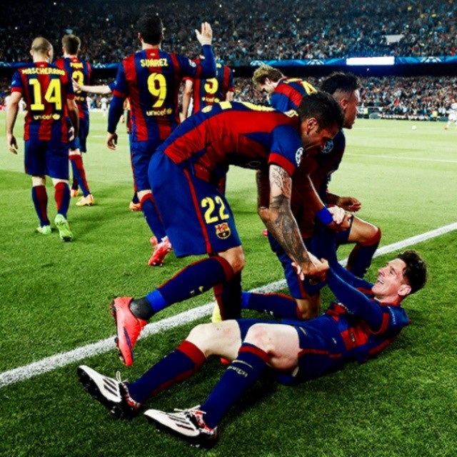Barcelona’s Lionel Messi celebrates scoring their second goal of the game with team-mate Dani Alves during the UEFA Champions League Semi Final First Leg soccer match, FC Barcelona Vs Bayern Munich at Nou Camp in Barcelona, Spain on May 6, 2015.