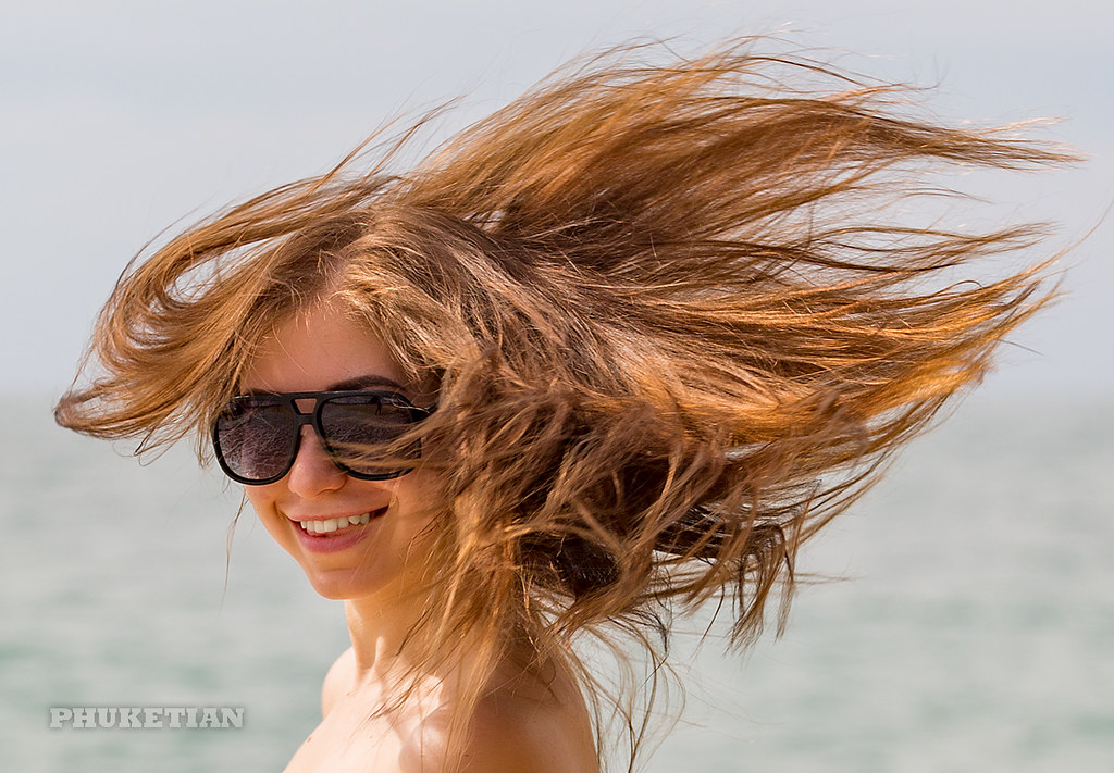 : Girl on the beach. Windy day                    XOKA1058bs2