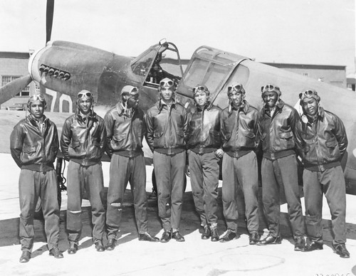 Eight Tuskegee Airmen in front of a P-40 fighter aircraft-42-43. ©  Robert Sullivan