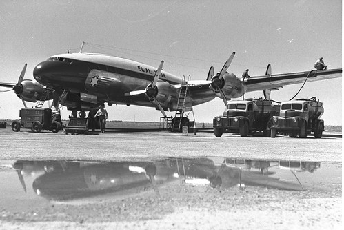 MAINTENANCE STAFF REFUEL AN EL AL PLANE, AT LOD   AIRPORT.   1 April 1951 ©  Robert Sullivan