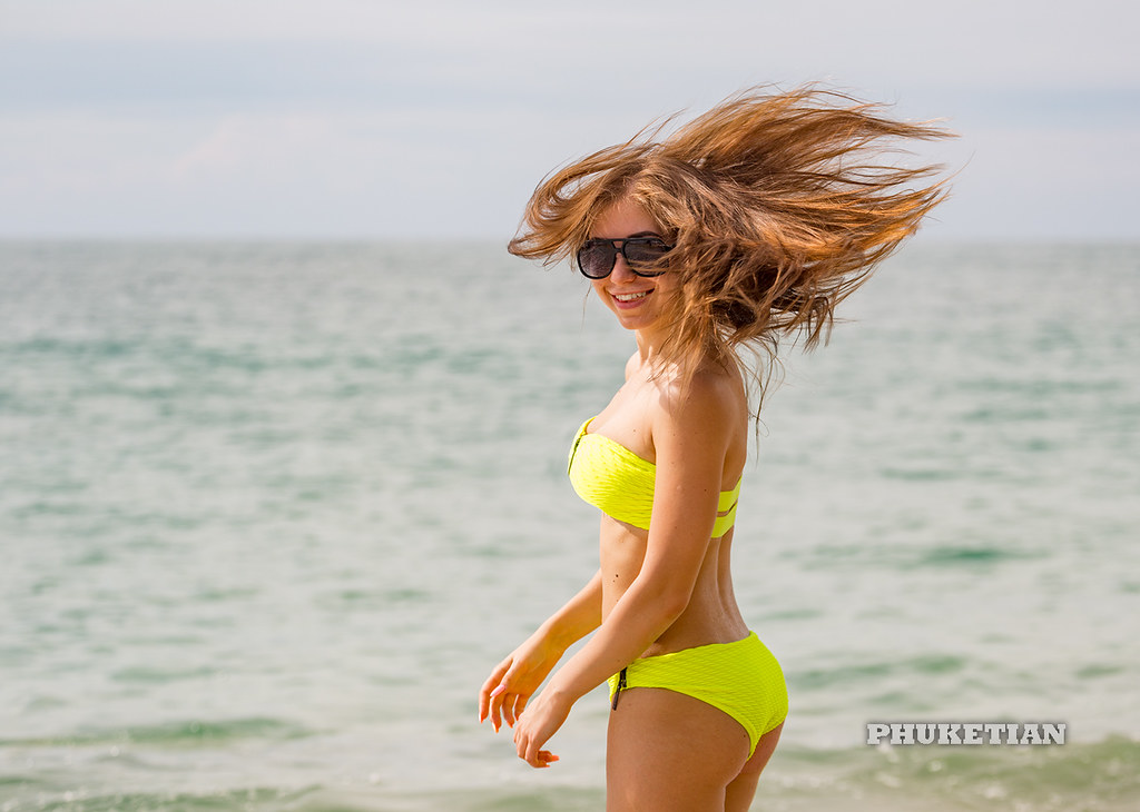 : Girl on the beach. Windy day                    XOKA1058bs